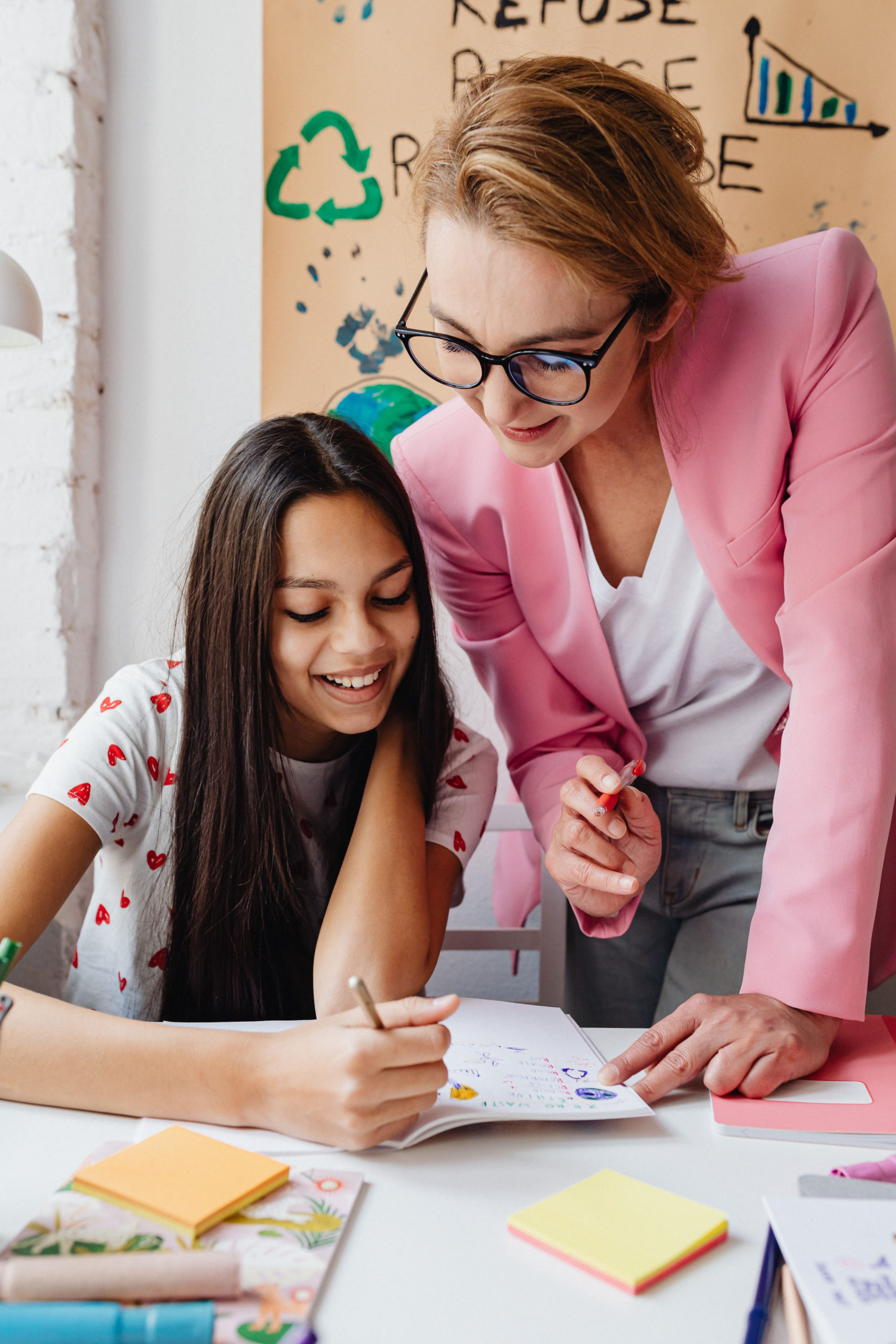Teacher helping student